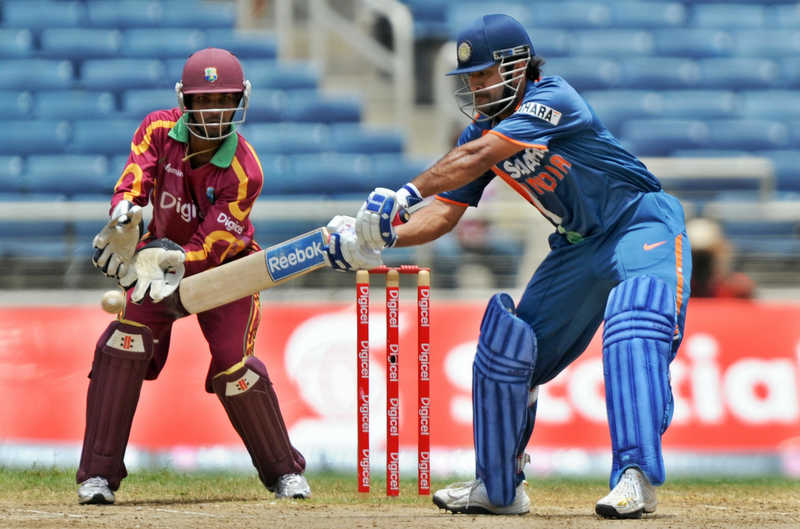 MS Dhoni in action as Ramdin is watching behind