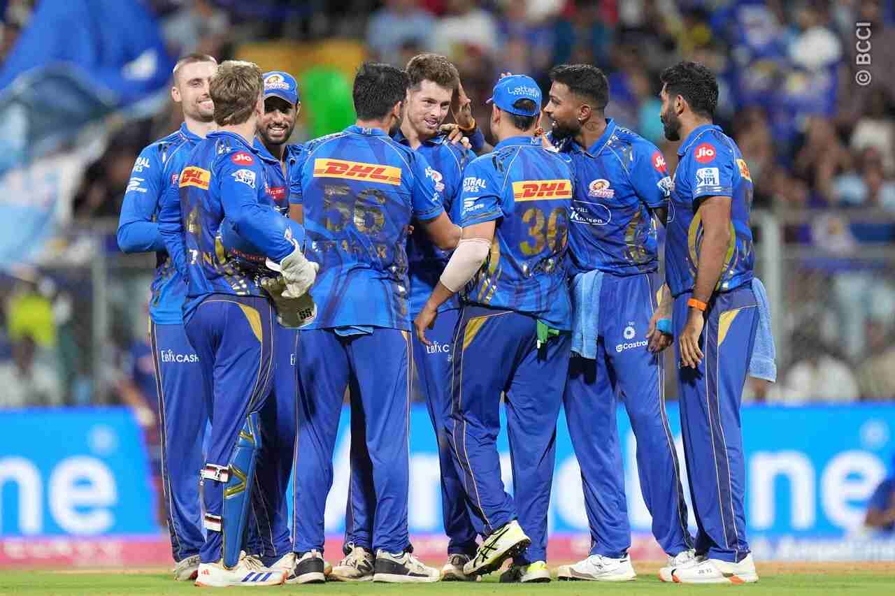 MI players celebrate a dismissal during their match against DC at the Wankhede Stadium in Mumbai.